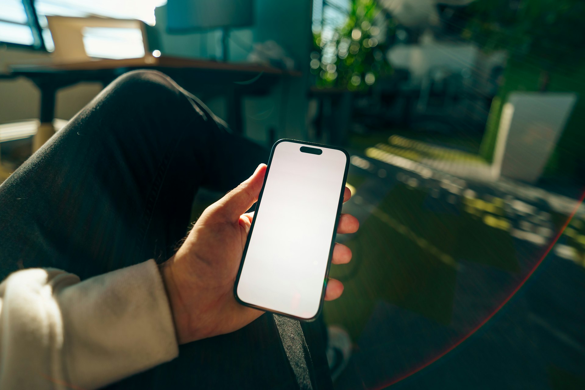 Hand holding a smartphone for mobile app design
